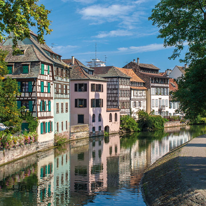 Pastel coloured houses bordering Strasbourg canal